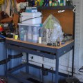 T01. Metal and pegboard work bench. 
